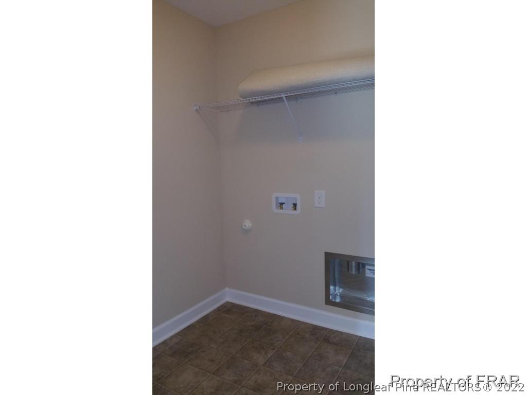 157 Shellbark Drive Spring Lake, NC 28390 - Photo 8 of 17 a view of a room with a white wall and a window