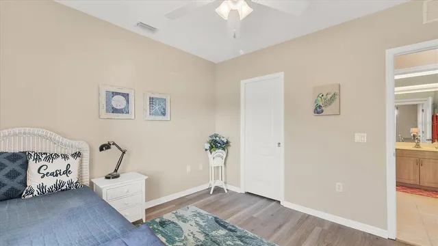 a dining room with furniture water view and a floor to ceiling window