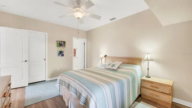 a sign of golf club on a wall under a tree