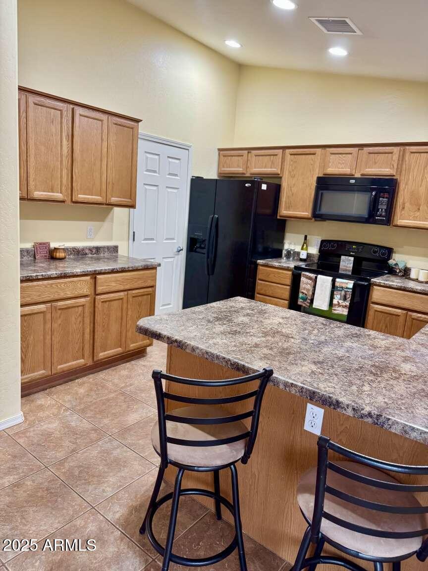 4660 Monument Way Rimrock, AZ 86335 - Photo 11 of 33 a kitchen with stainless steel appliances granite countertop a sink and a refrigerator