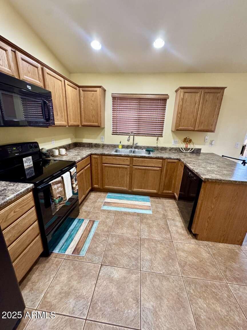 4660 Monument Way Rimrock, AZ 86335 - Photo 13 of 33 a kitchen with stainless steel appliances granite countertop a sink stove and cabinets