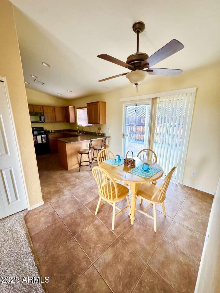 4660 Monument Way Rimrock, AZ 86335 - Photo 15 of 33 a living room with a couch and a chandelier
