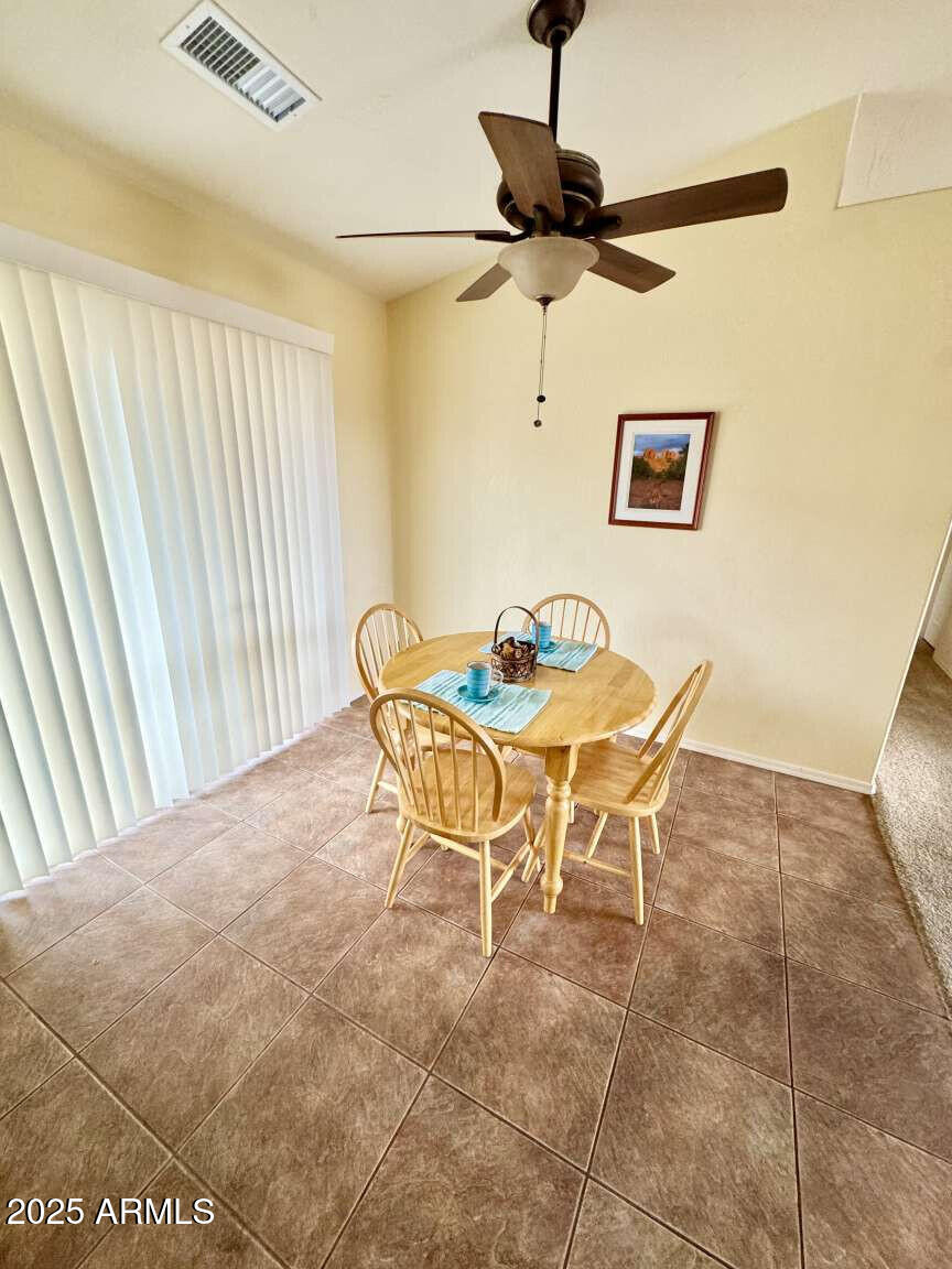 4660 Monument Way Rimrock, AZ 86335 - Photo 17 of 33 a dining room with a table and chairs