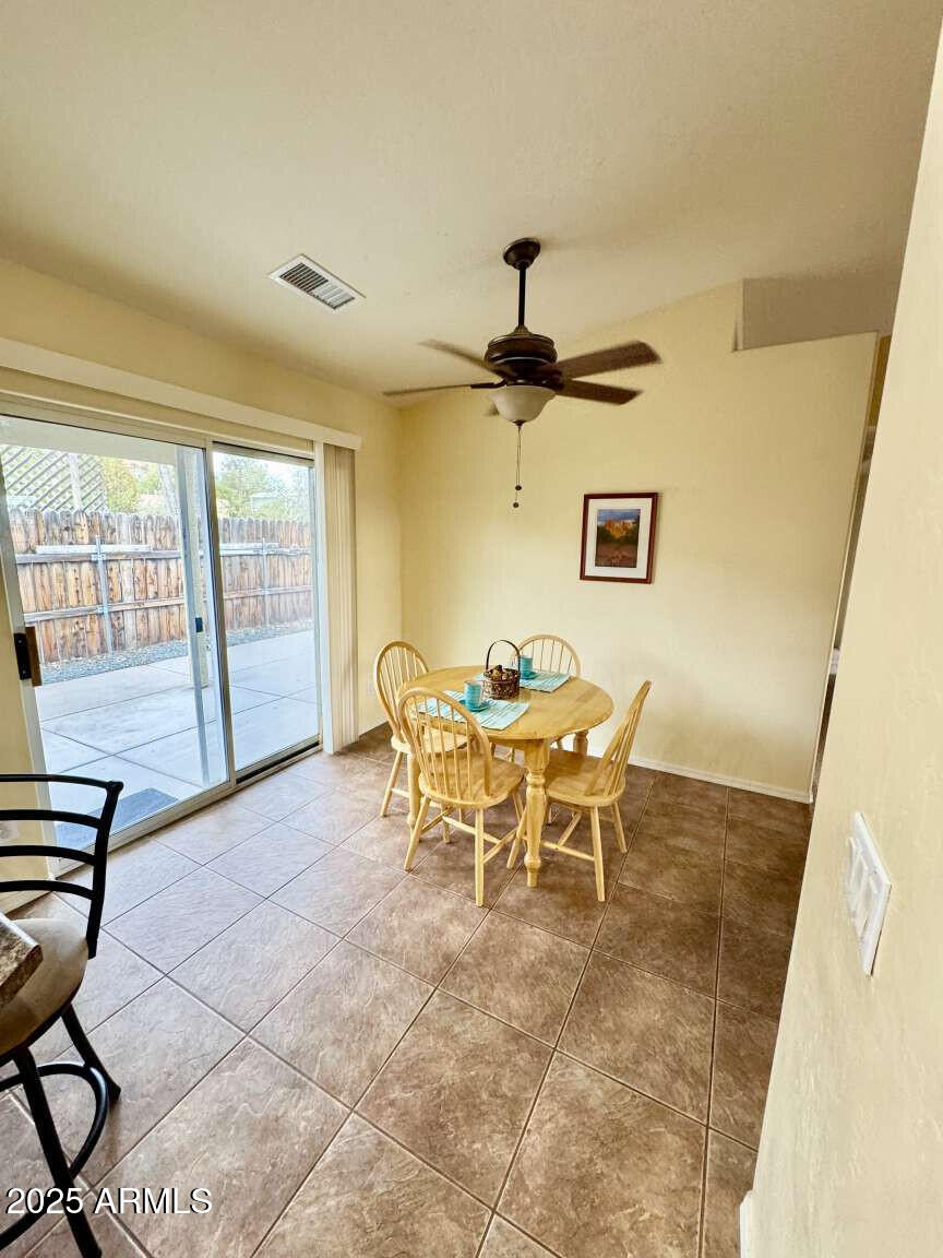 4660 Monument Way Rimrock, AZ 86335 - Photo 18 of 33 a dining room with furniture and a window