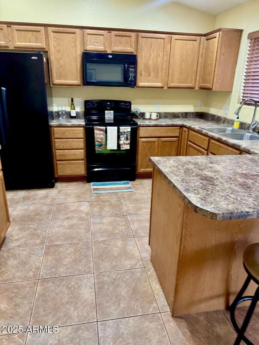 4660 Monument Way Rimrock, AZ 86335 - Photo 10 of 33 a kitchen with stainless steel appliances granite countertop a sink stove and granite counter top