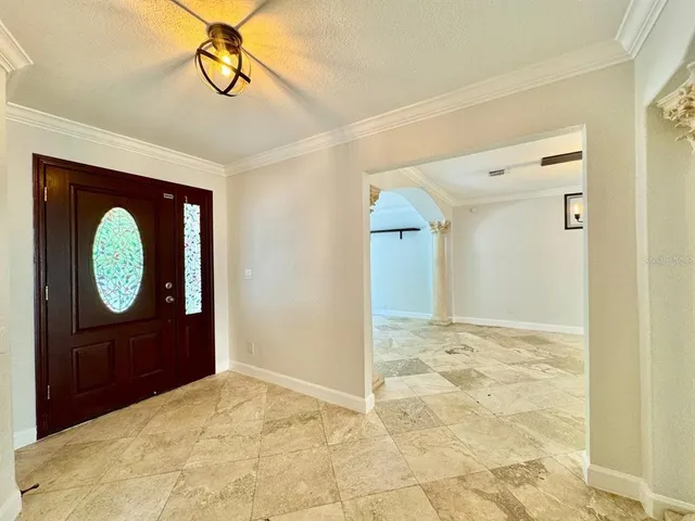 a view of a livingroom with wooden floor and windows