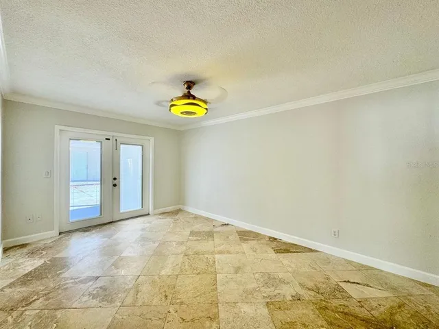 a view of an empty room and a window
