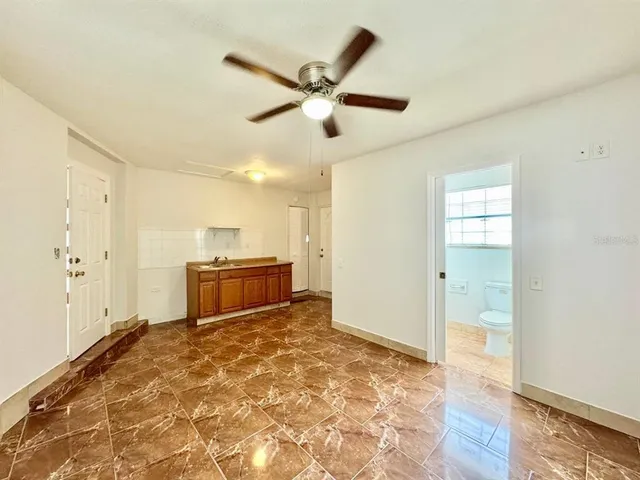 a view of a kitchen with a sink and a stove