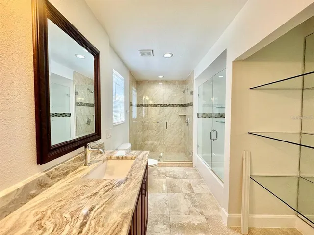 a bathroom with a bathtub and shower