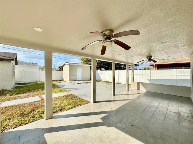 a view of a house with snow on the background