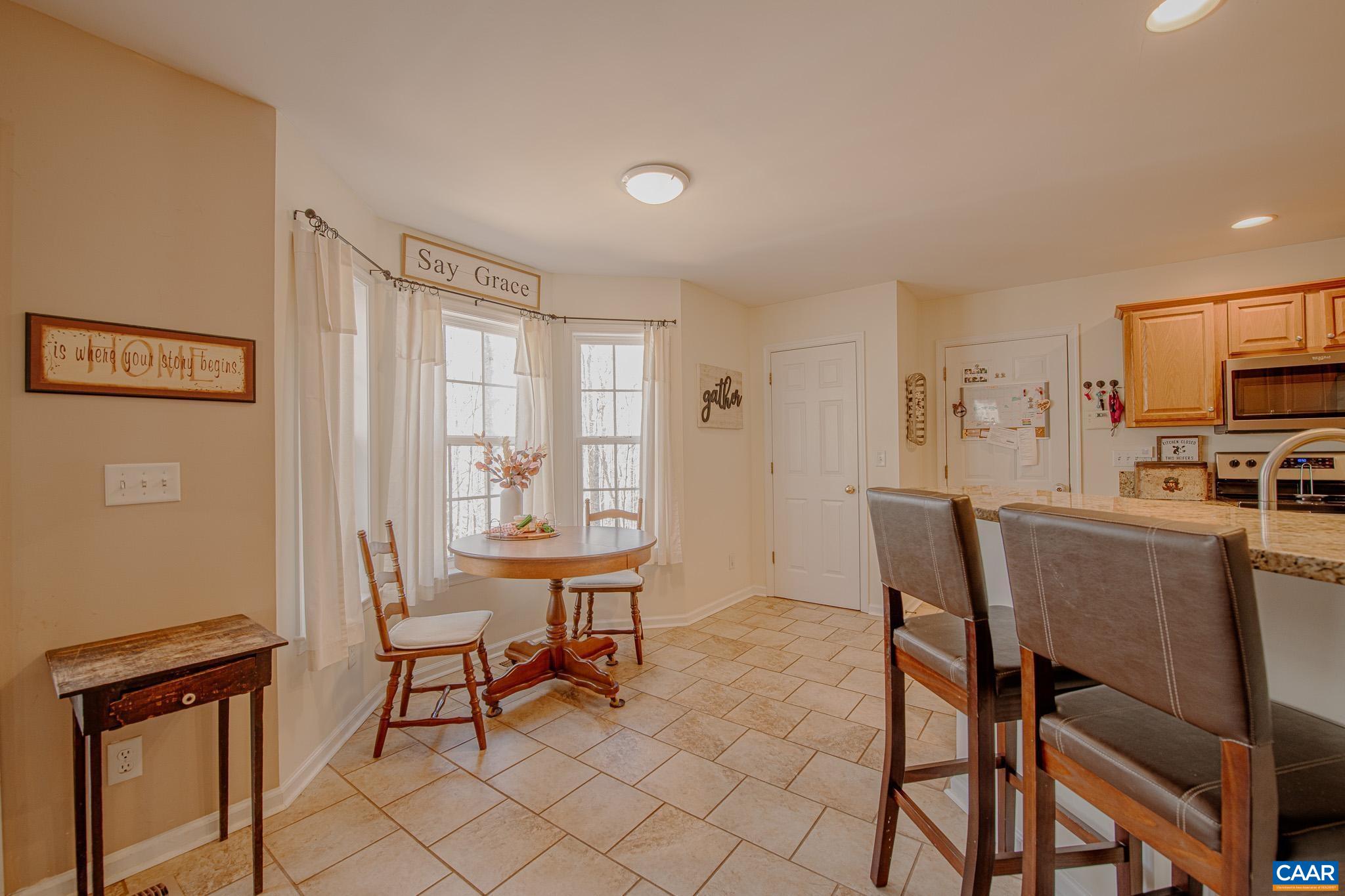 116 Riverside Drive Palmyra, VA 22963 - Photo 12 of 31 a view of a dining room with furniture and a window