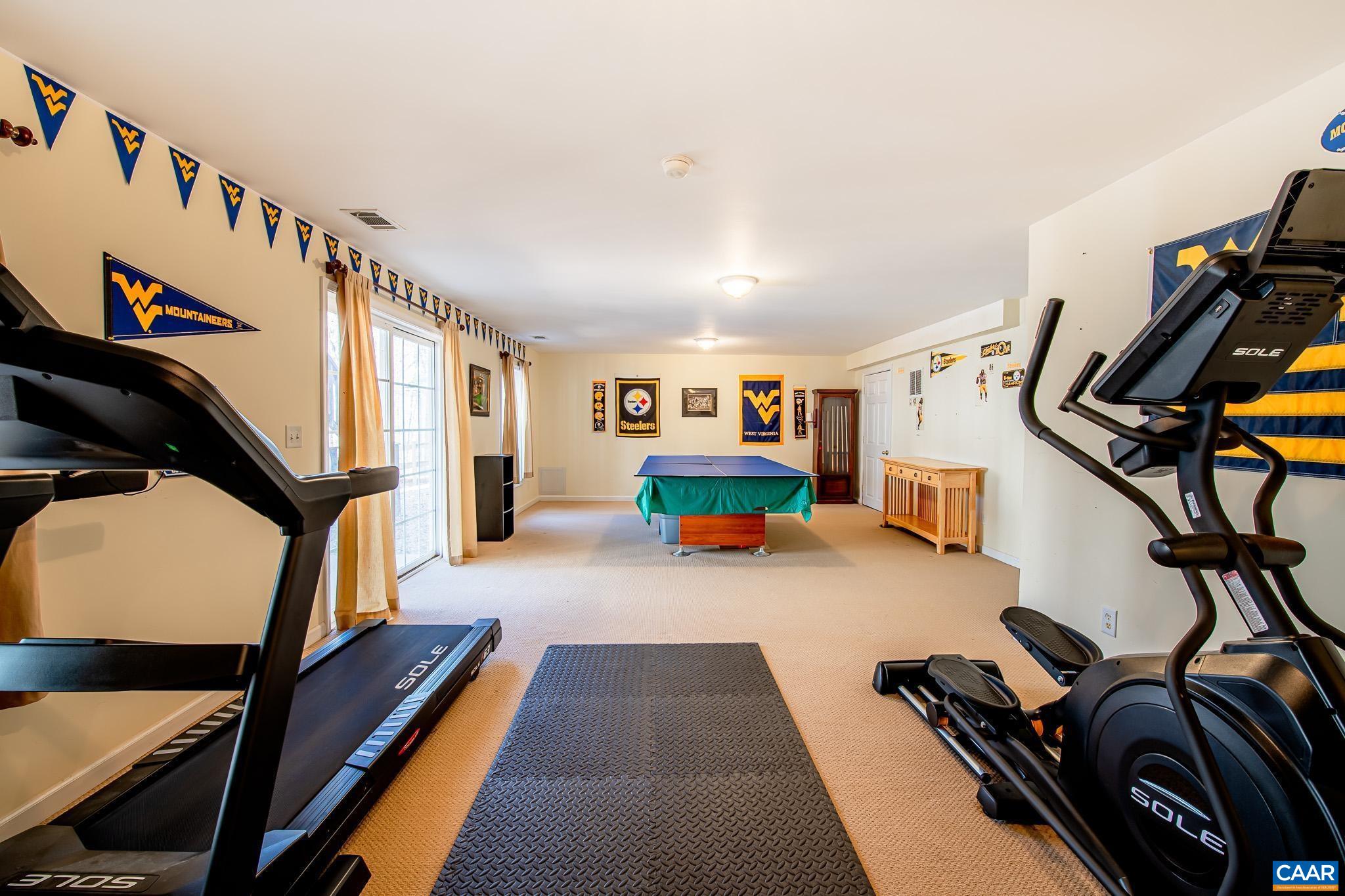 116 Riverside Drive Palmyra, VA 22963 - Photo 25 of 31 a bedroom with furniture and a staircase