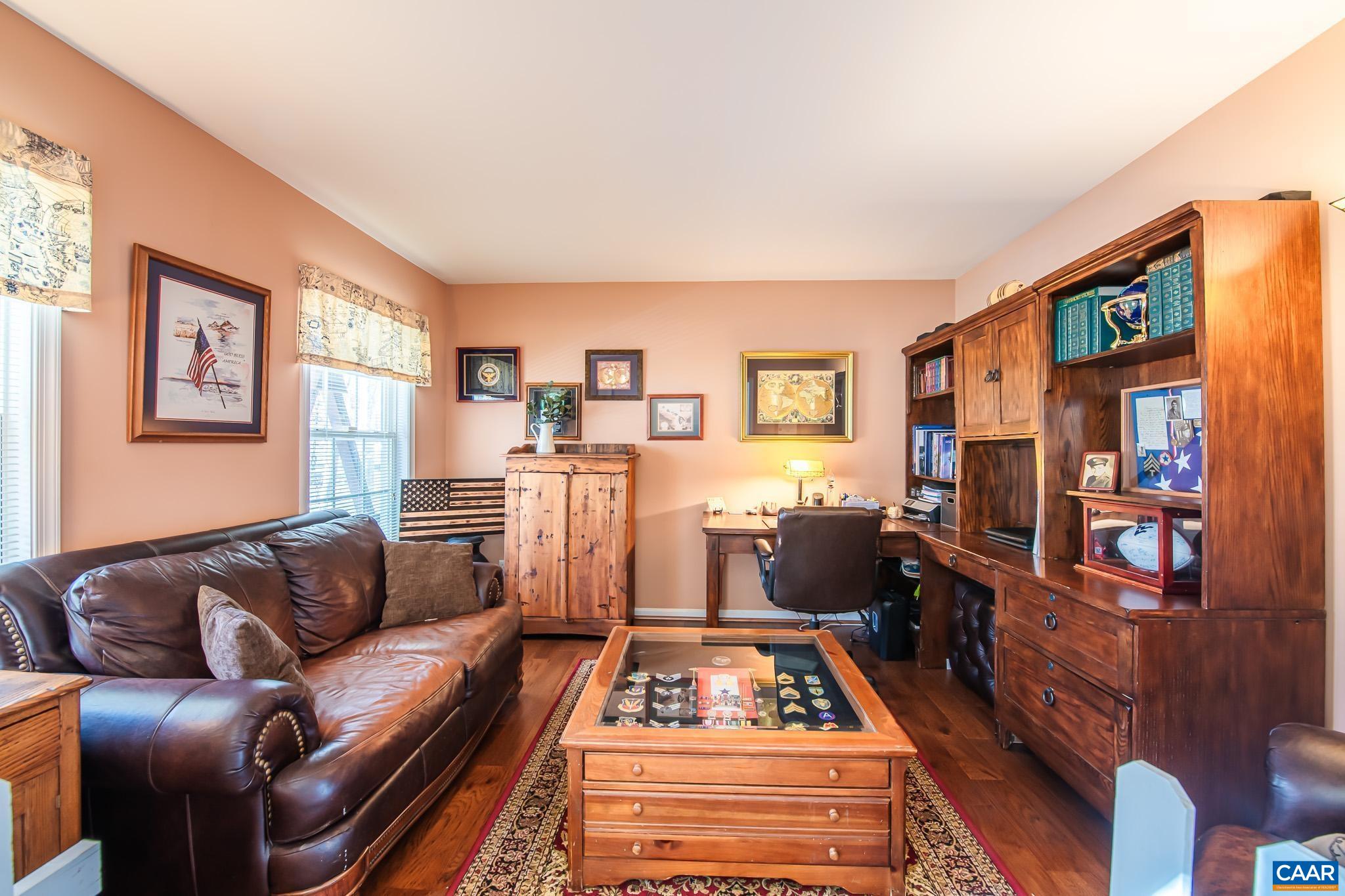 116 Riverside Drive Palmyra, VA 22963 - Photo 5 of 31 a living room with furniture and a flat screen tv