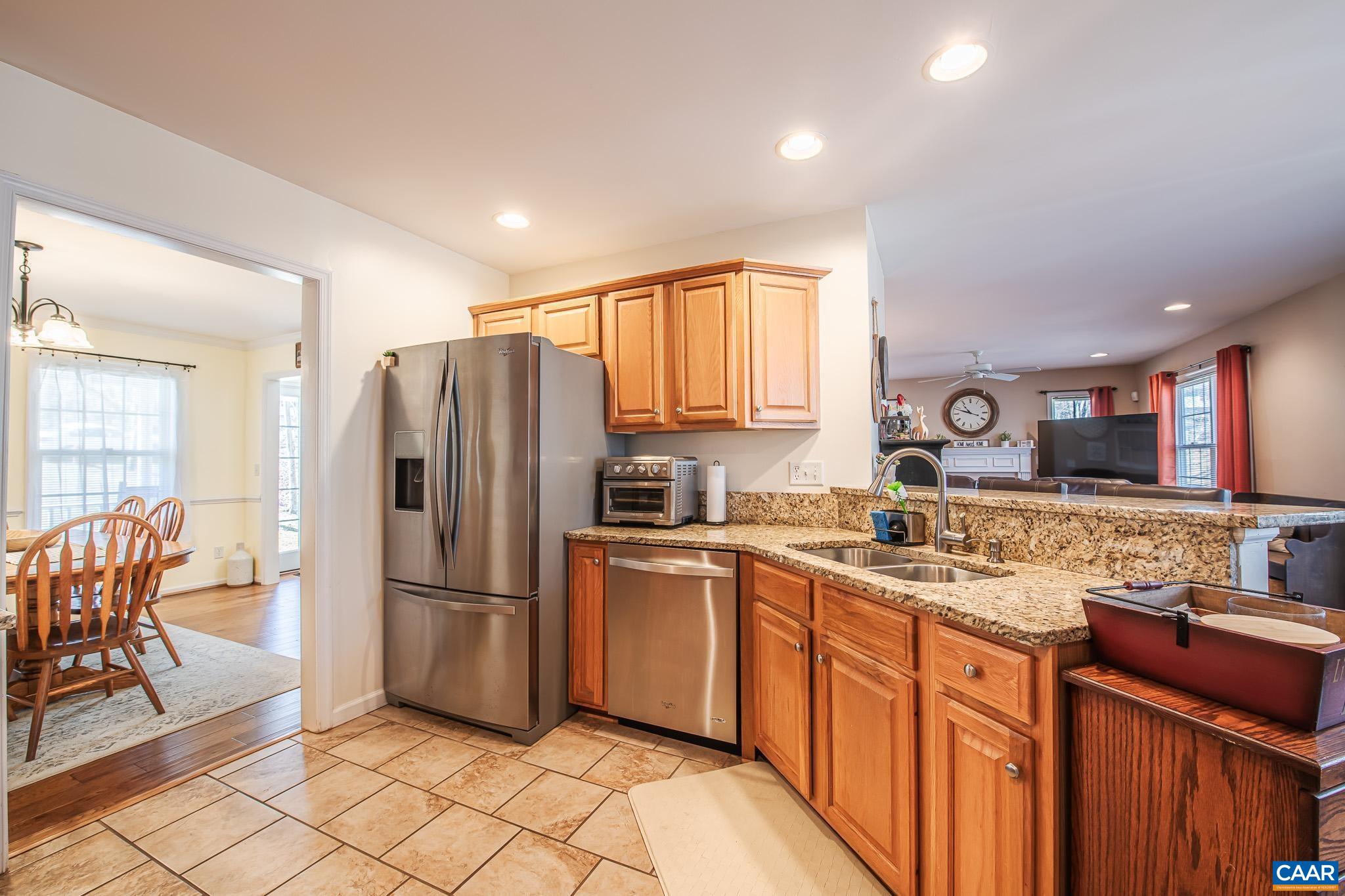 116 Riverside Drive Palmyra, VA 22963 - Photo 9 of 31 a kitchen with stainless steel appliances granite countertop a refrigerator stove top oven and sink