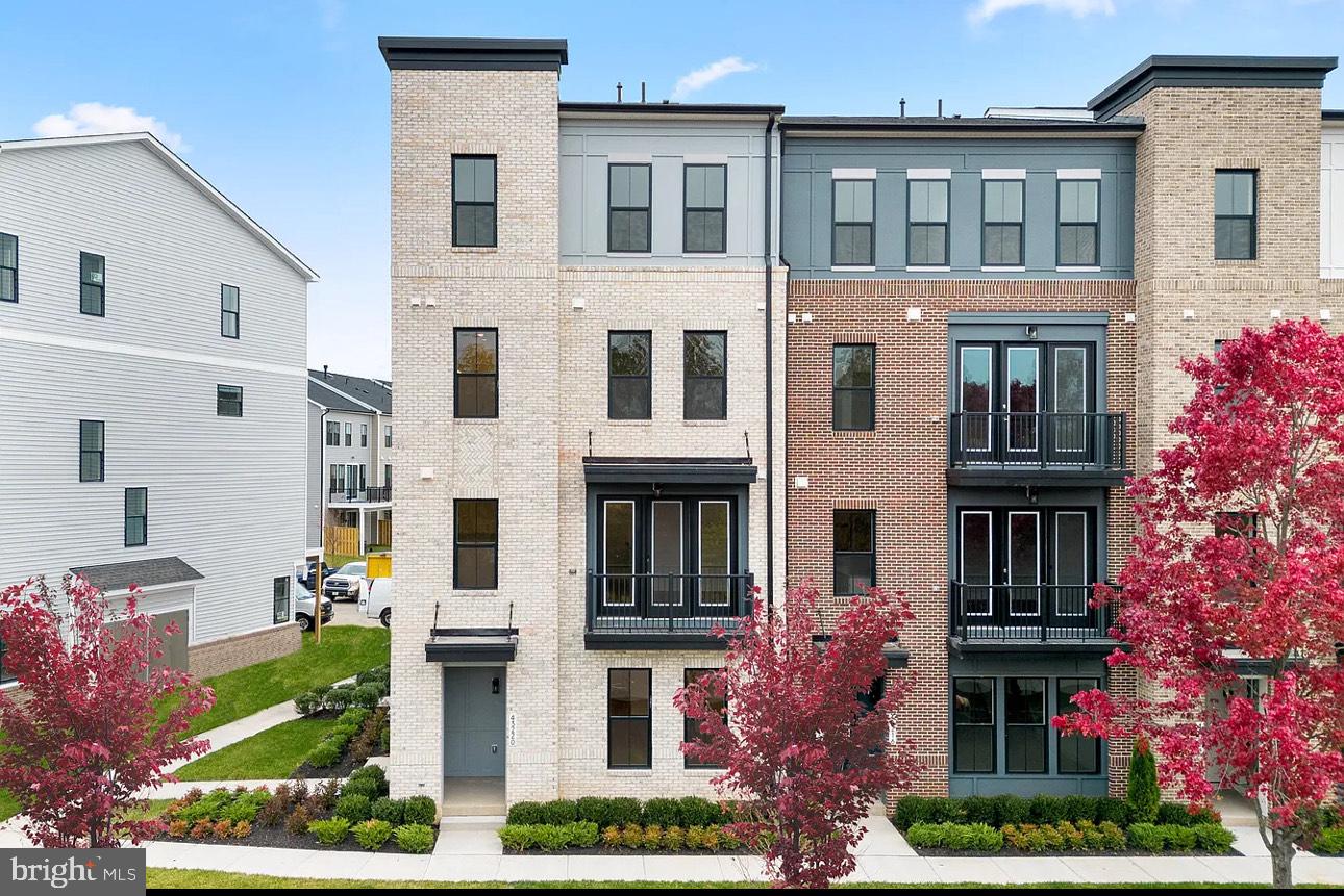 43312 Farringdon Square, Unit 215 Ashburn, VA 20148 - Photo 1 of 10 a front view of multi story residential apartment building
