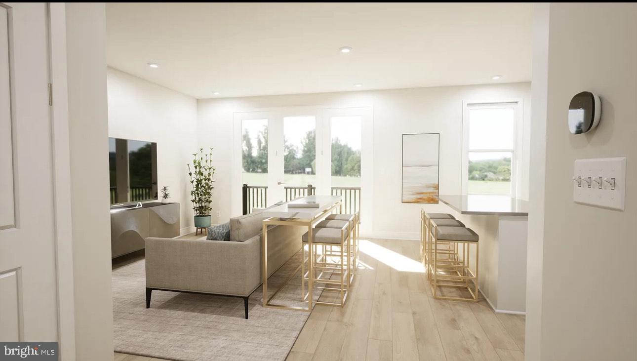 43312 Farringdon Square, Unit 215 Ashburn, VA 20148 - Photo 7 of 10 a living room with furniture and a large window