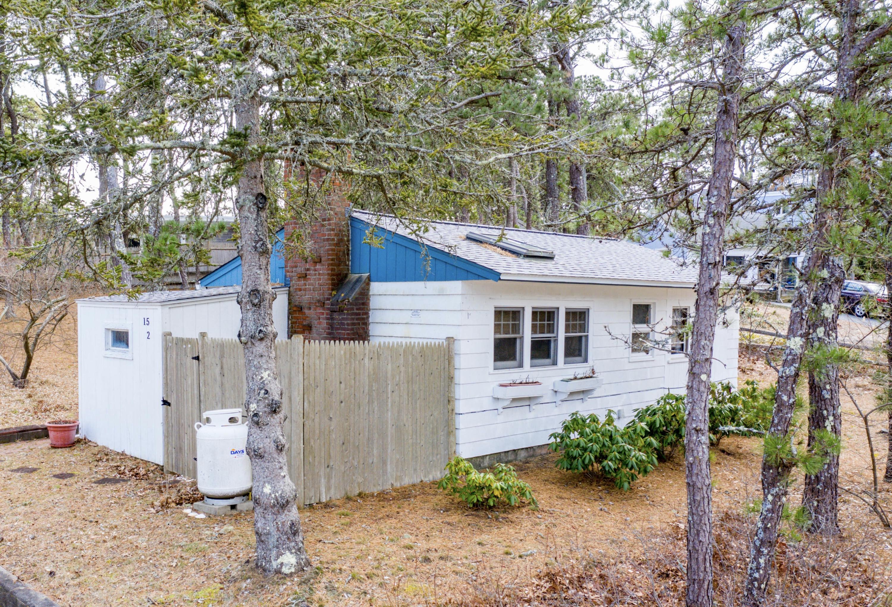 15 Massasoit Road Wellfleet, MA 02667 - Photo 1 of 23 a view of a house with a yard and sitting area