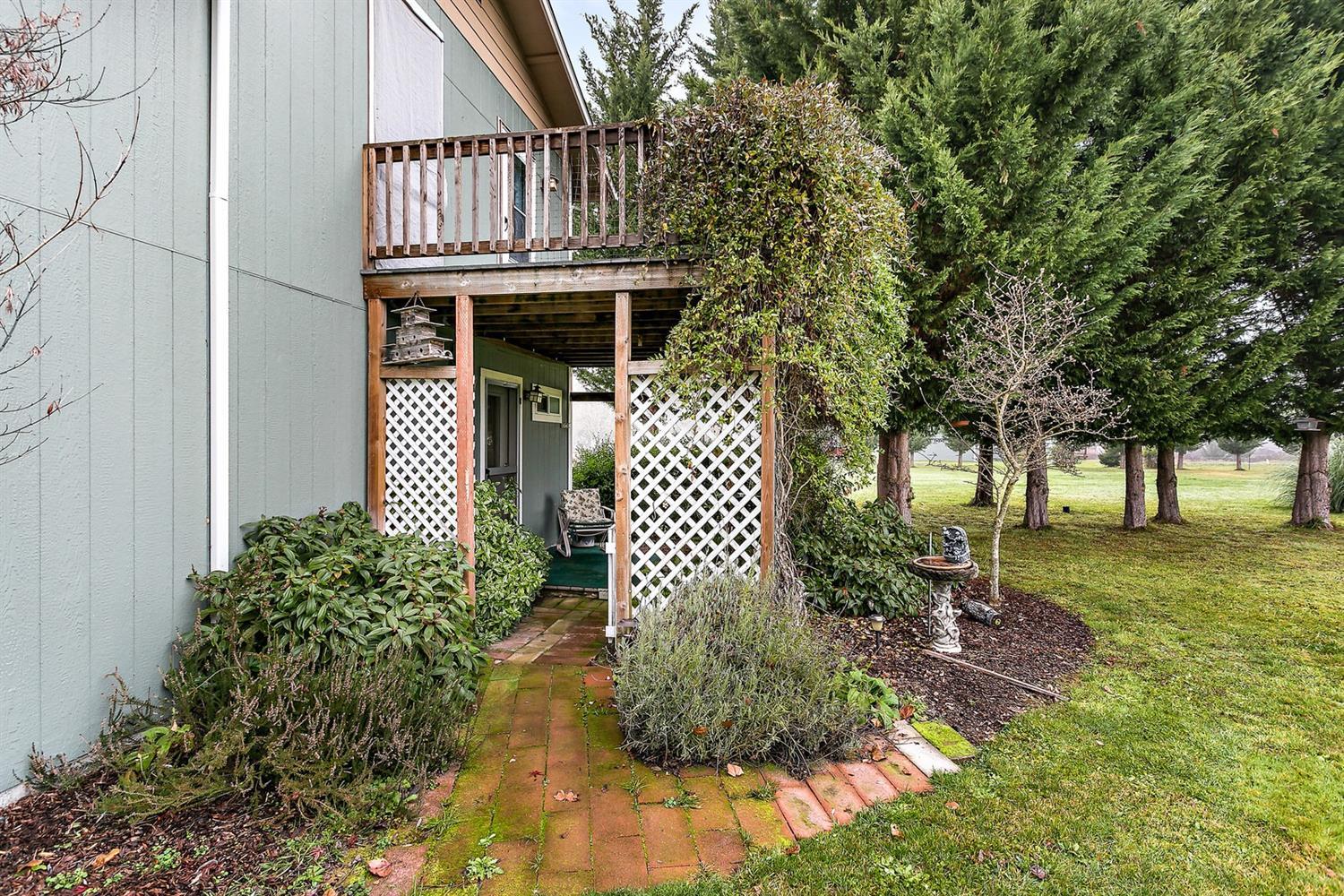4930 Leonard Road Grants Pass, OR 97527 - Photo 25 of 33 a front view of a house with garden