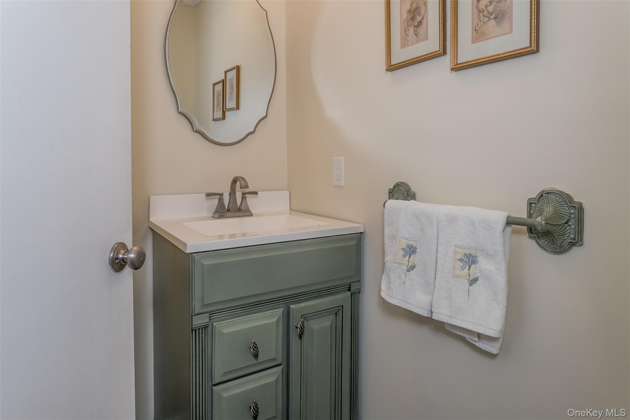 9 Olde Wagon Road Warwick, NY 10990 - Photo 11 of 25 a bathroom with a sink vanity and a mirror