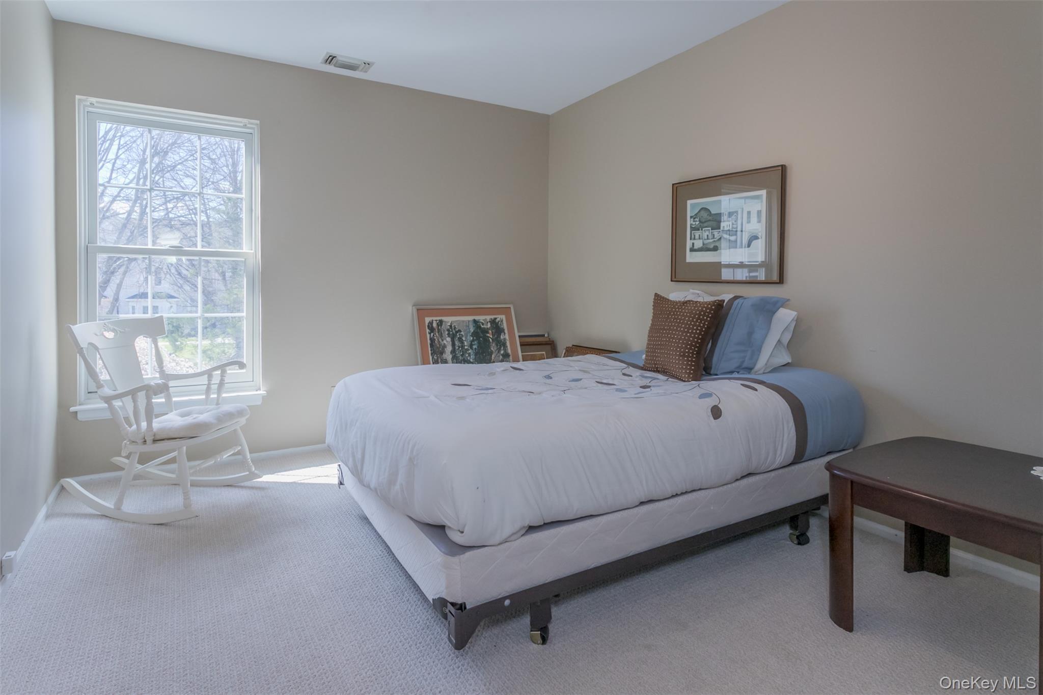 9 Olde Wagon Road Warwick, NY 10990 - Photo 14 of 23 a large bed sitting in a bedroom next to a window