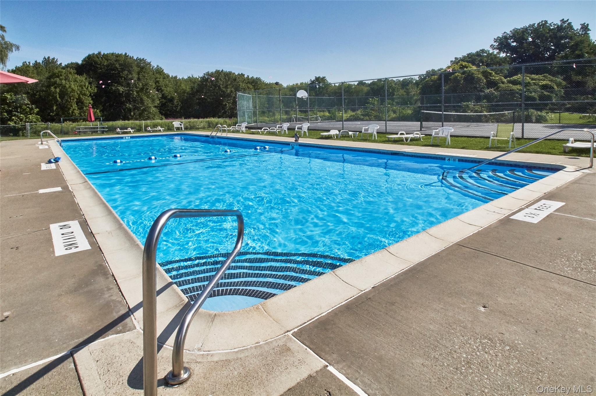 9 Olde Wagon Road Warwick, NY 10990 - Photo 19 of 23 a view of a swimming pool with a lounge chair