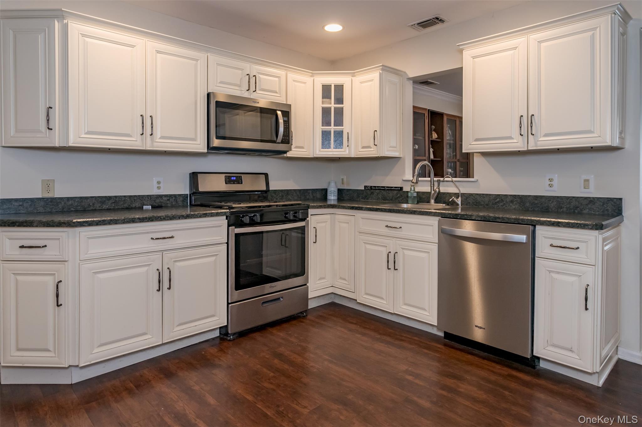 9 Olde Wagon Road Warwick, NY 10990 - Photo 7 of 25 a white kitchen with granite countertop stainless steel appliances