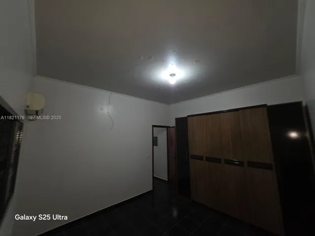 a bathroom with a granite countertop toilet sink and shower