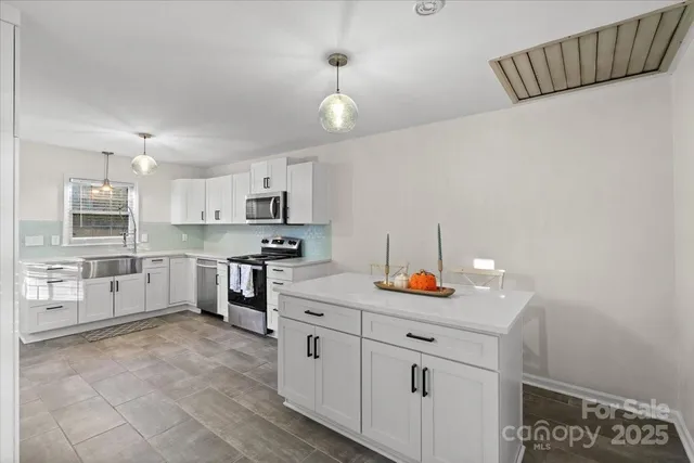 a bedroom with a bed and a view of bedroom