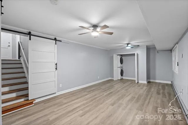 a bedroom with a large bed and a flat screen tv