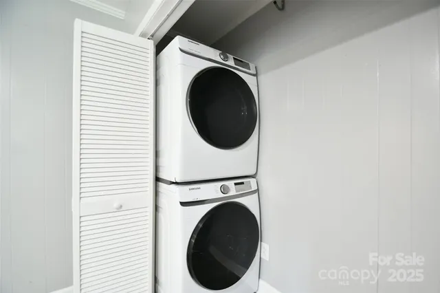 a view of patio with couches and a fire pit
