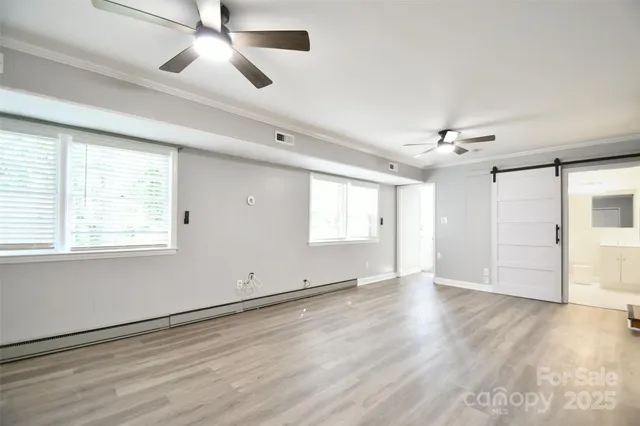 a view of porch with a table and chairs next to a yard