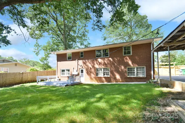 a bedroom with a bed and a potted plant