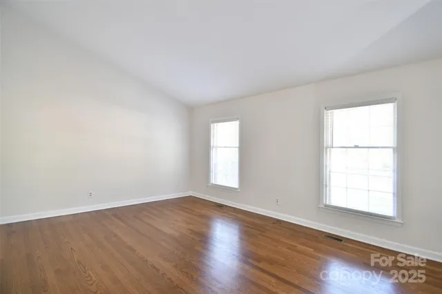 a kitchen with stainless steel appliances a sink dishwasher stove refrigerator and cabinets
