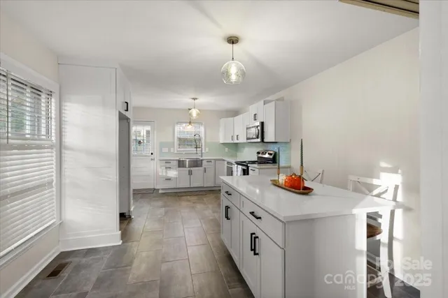 a bathroom with a toilet sink and shower