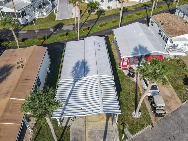 an aerial view of a house with a garden