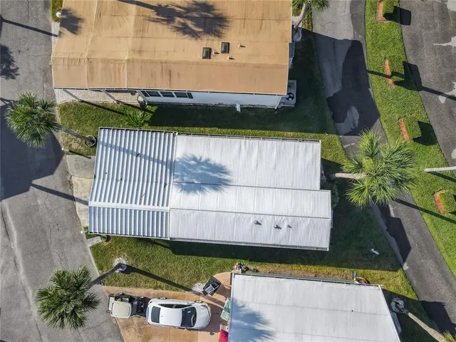 an aerial view of a house with outdoor space