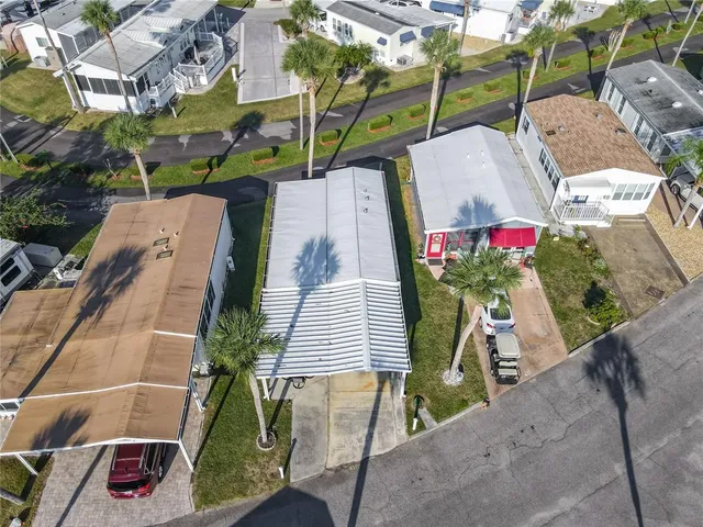 a aerial view of a dining tables and chairs in the ocean
