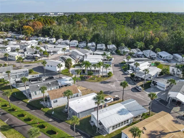 an aerial view of a house with a lake view