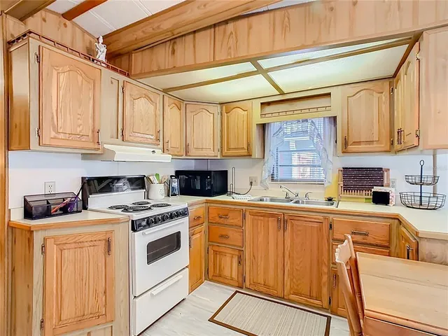 a bedroom with a large bed and a mirror