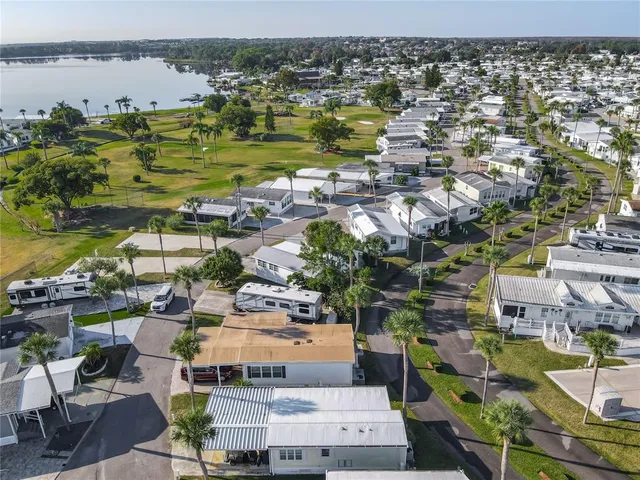 a view of a patio with table and chairs under an umbrella