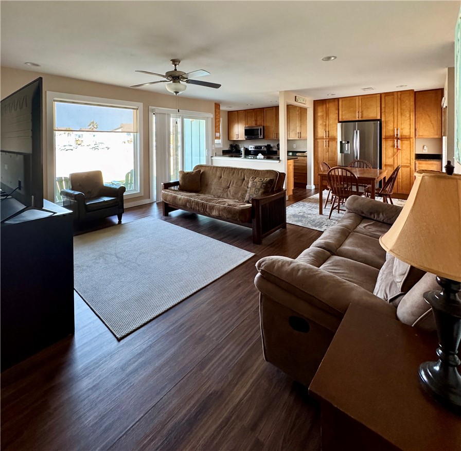 230 Cut-Off Road, Unit B107 Port Aransas, TX 78373 - Photo 6 of 25 a living room with furniture fireplace and large windows