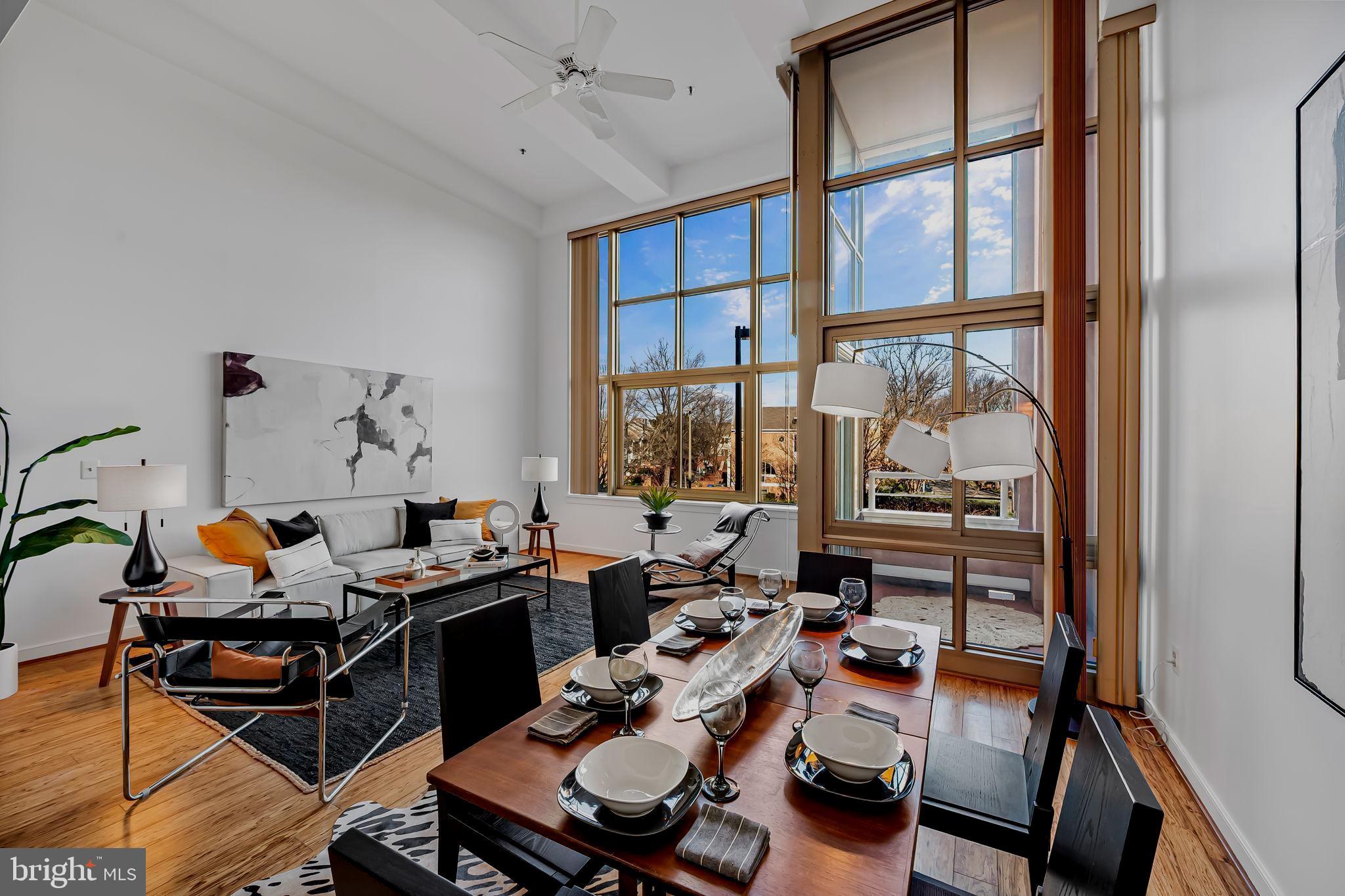 2901 Boston Street, Unit 204 Baltimore, MD 21224 - Photo 12 of 60 a room with furniture and a large window