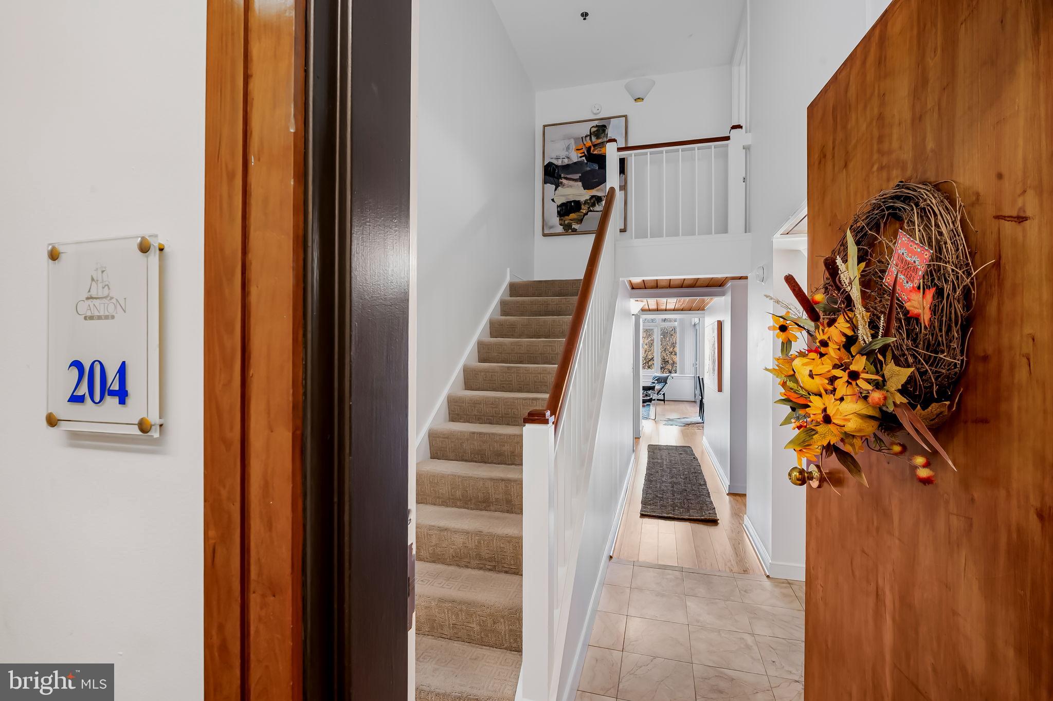 2901 Boston Street, Unit 204 Baltimore, MD 21224 - Photo 3 of 60 a view of entryway with wooden floor