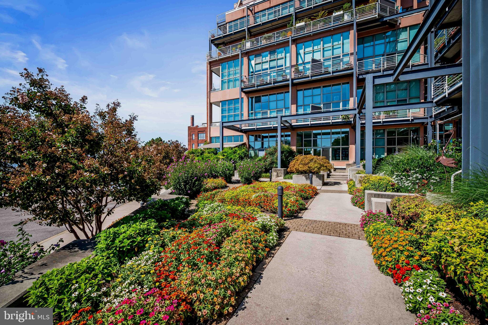 2901 Boston Street, Unit 204 Baltimore, MD 21224 - Photo 42 of 60 a view of a building with garden