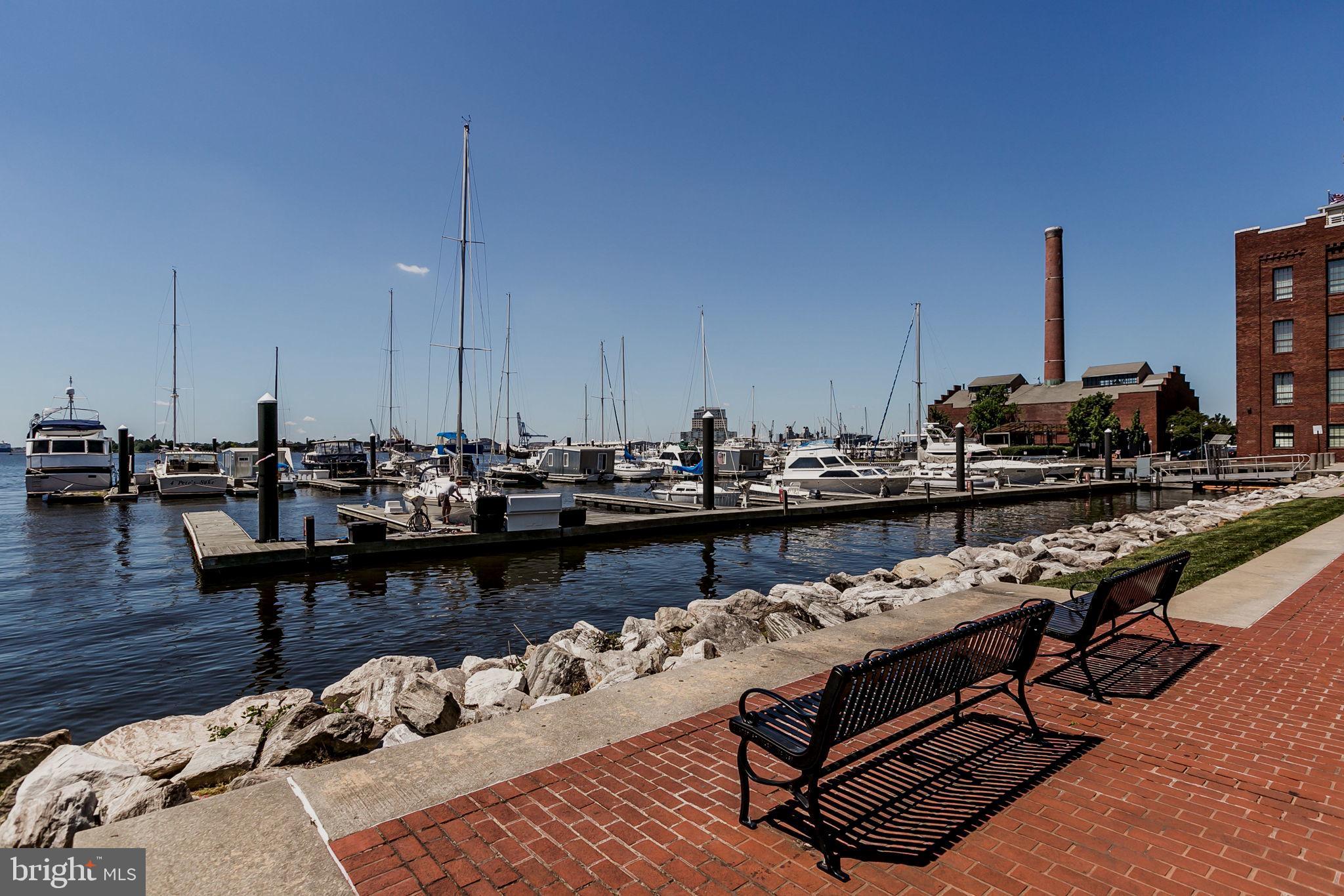 2901 Boston Street, Unit 204 Baltimore, MD 21224 - Photo 46 of 60 a living room with lots of furniture and wooden floor