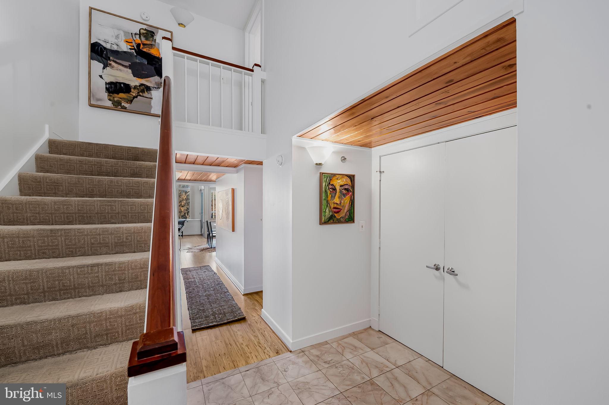 2901 Boston Street, Unit 204 Baltimore, MD 21224 - Photo 5 of 60 a view of a hallway with wooden floor and staircase