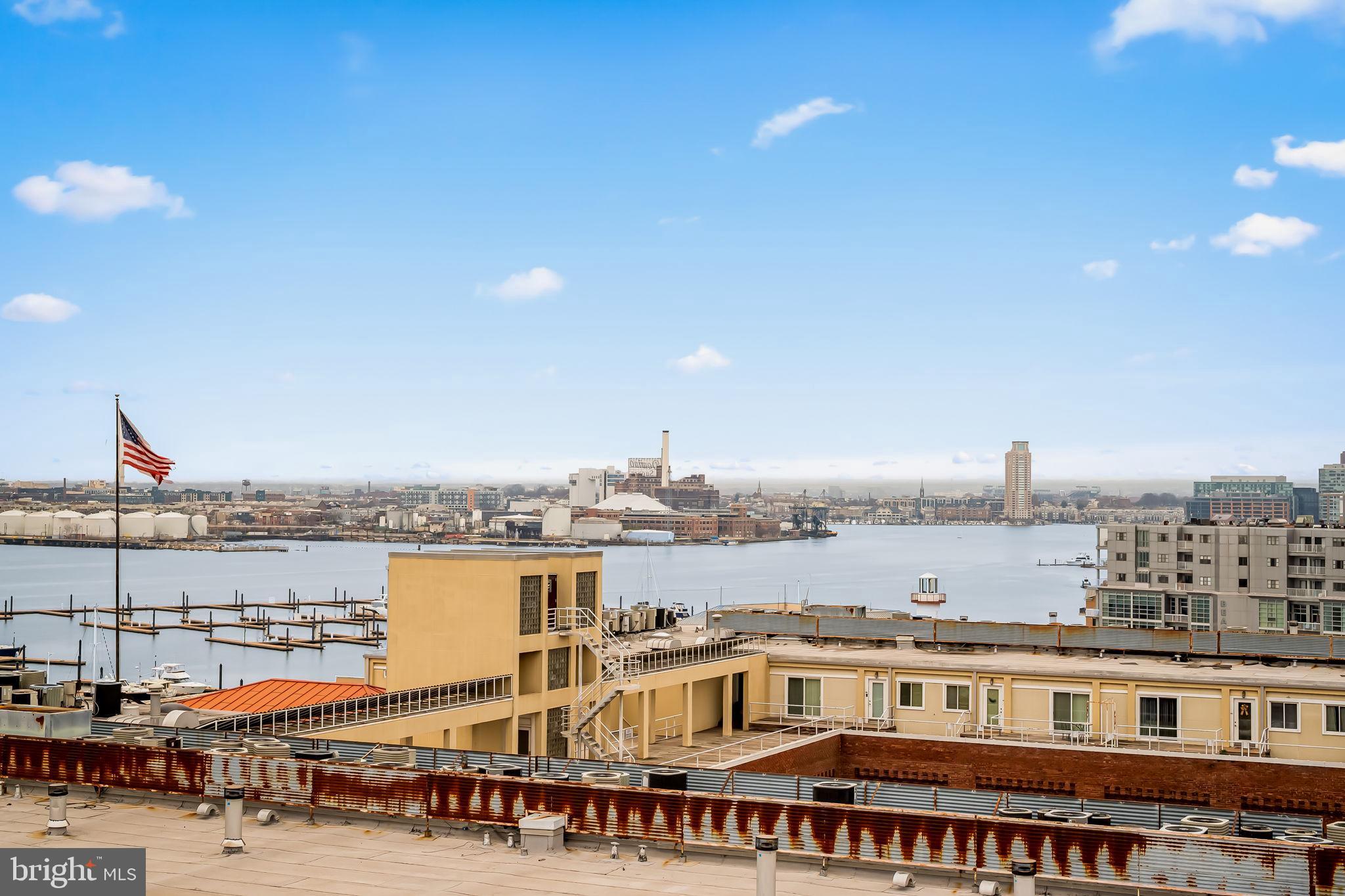 2901 Boston Street, Unit 204 Baltimore, MD 21224 - Photo 51 of 60 a large building with a city view