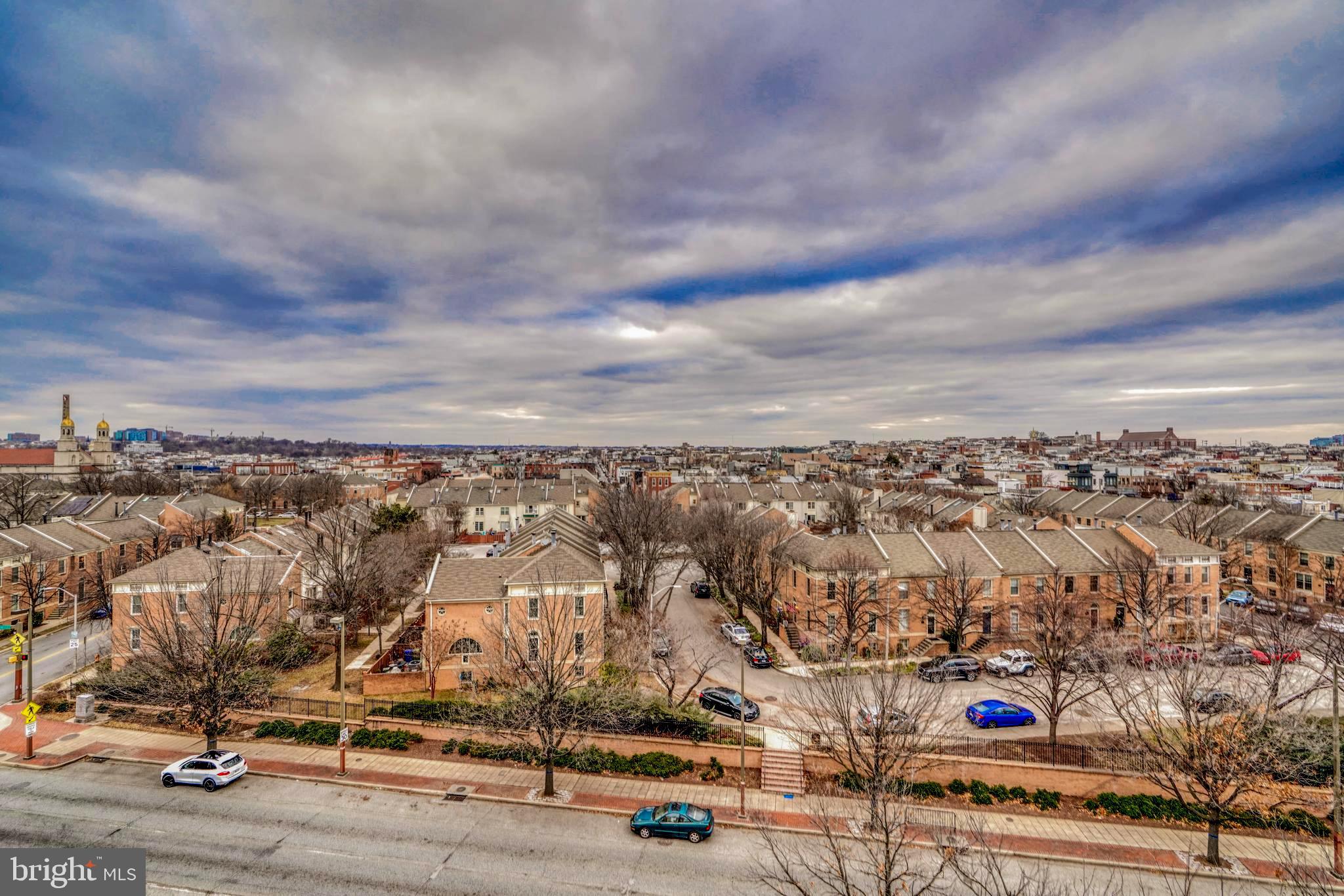 2901 Boston Street, Unit 204 Baltimore, MD 21224 - Photo 56 of 60 an aerial view of residential building with parking