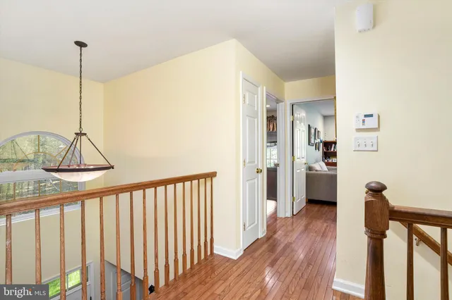 a view of a hallway with a kitchen