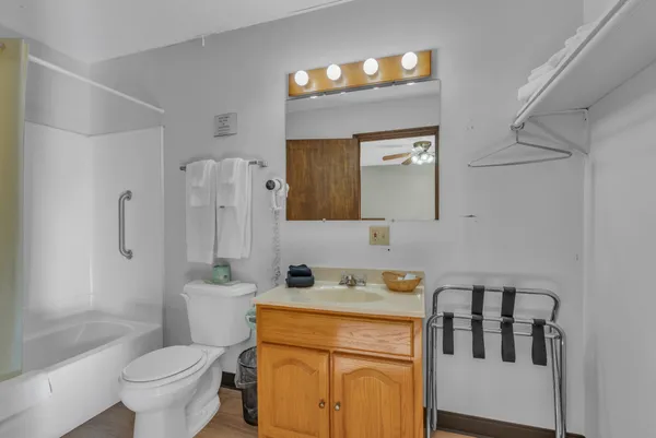 a bathroom with a toilet a sink and a bathtub